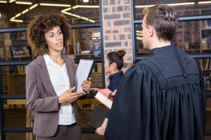 Lawyer interacting with businesswoman in office