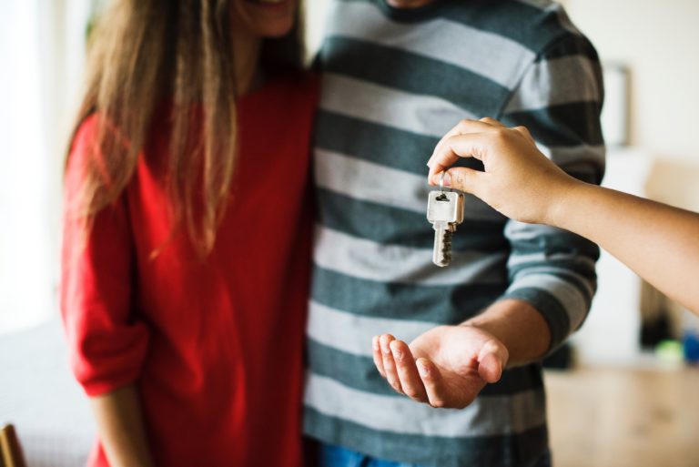 Couples getting keys for their real estate