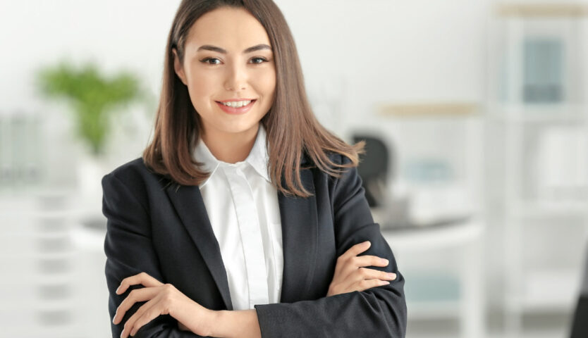 Professional woman with arms crossed in an office setting